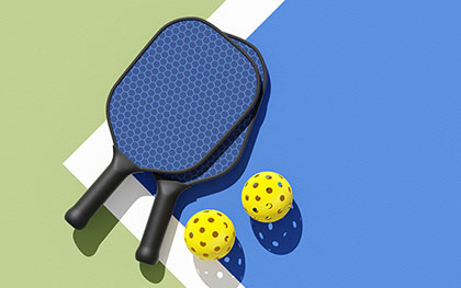 pickleball paddle and balls