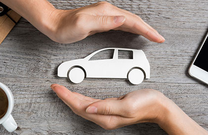hands over an image of a car