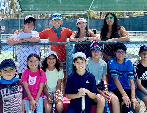 kids posing at a tennis camp