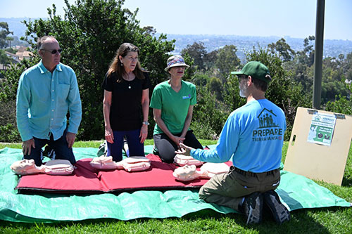 People demonstrating saving a life