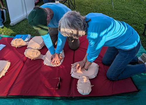 People demonstrating saving a life