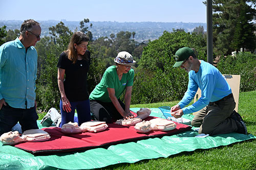 People demonstrating saving a life
