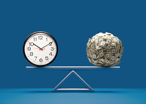 clock and money ball on a teetor totter